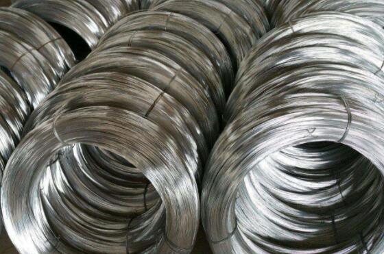 Why does galvanized wire burn violently in oxygen and spark?
